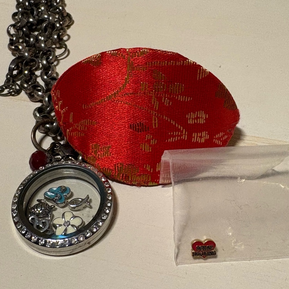 Origami Owl necklace. With flip flops, white flower, music note and more.
